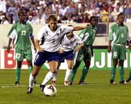 United States forward Mia Hamm scores on a penalty kick    Thursday, September 25, 2003 at Lincoln Financial Field, Philadelphia during  the opening round of the FIFA Women's 2003 World Cup.  The U. S. defeated Nigeria 5 - 0 before 31,000 fans. (Photo by A. Messerschmidt/Getty Images)